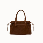 Garance camel tote bag side view on a light background