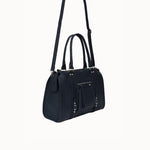 Sac à main Noema bleu marine vue de trois-quarts avec la bandoulière
